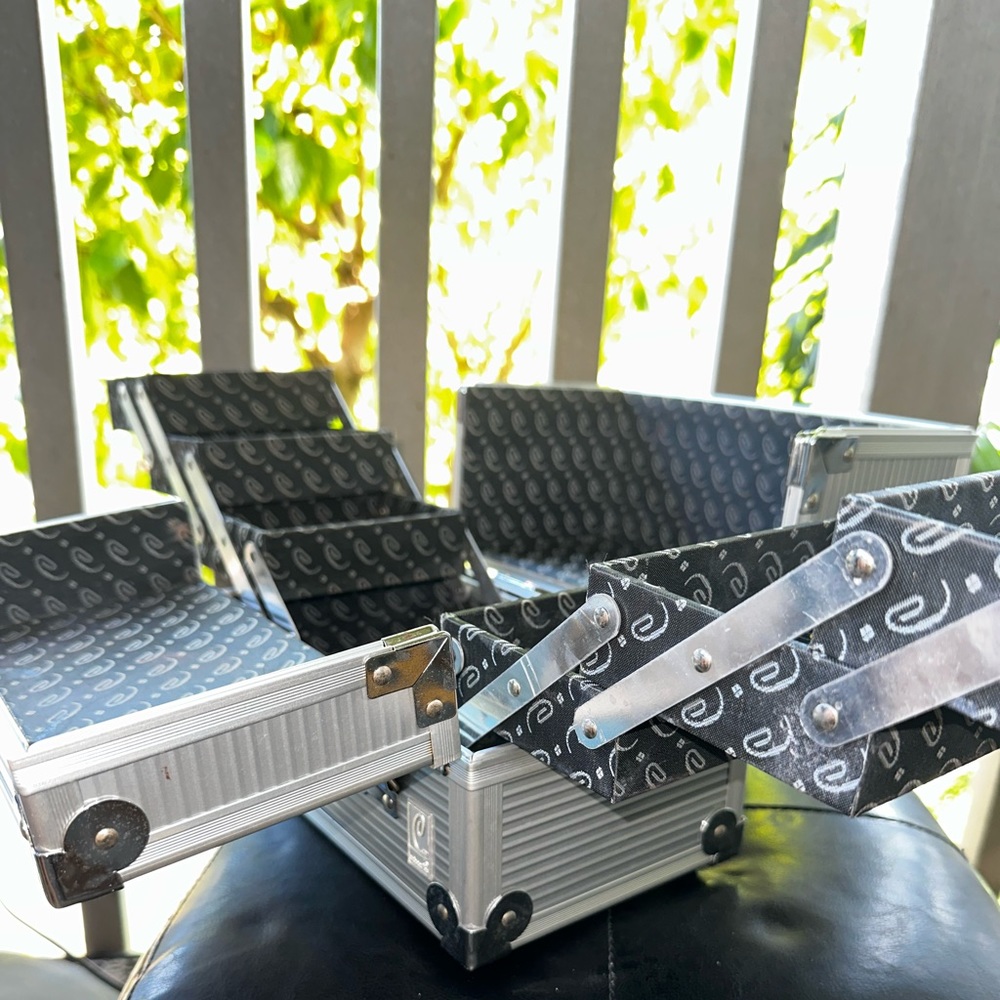 Caboodle silver make up box.